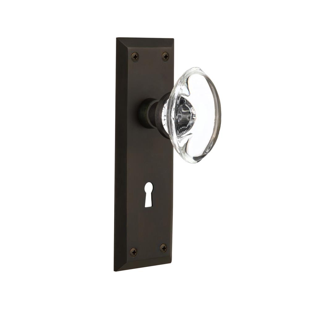 Nostalgic Warehouse NYKOCC Privacy Knob New York Plate with Oval Clear Crystal Knob with Keyhole in Oil Rubbed Bronze